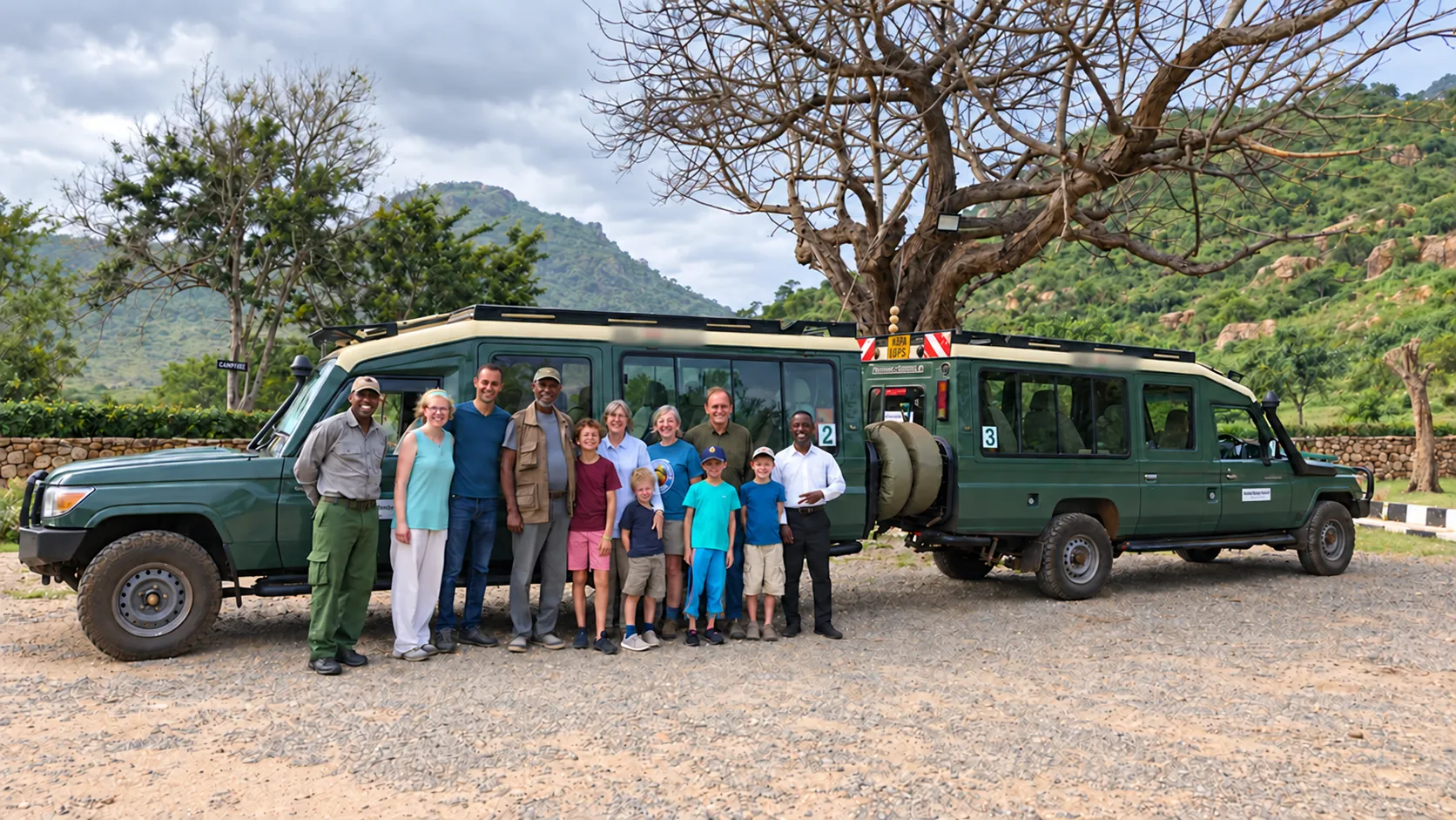 Inside Kenya Safaris guides with a guest group and the safari fleet