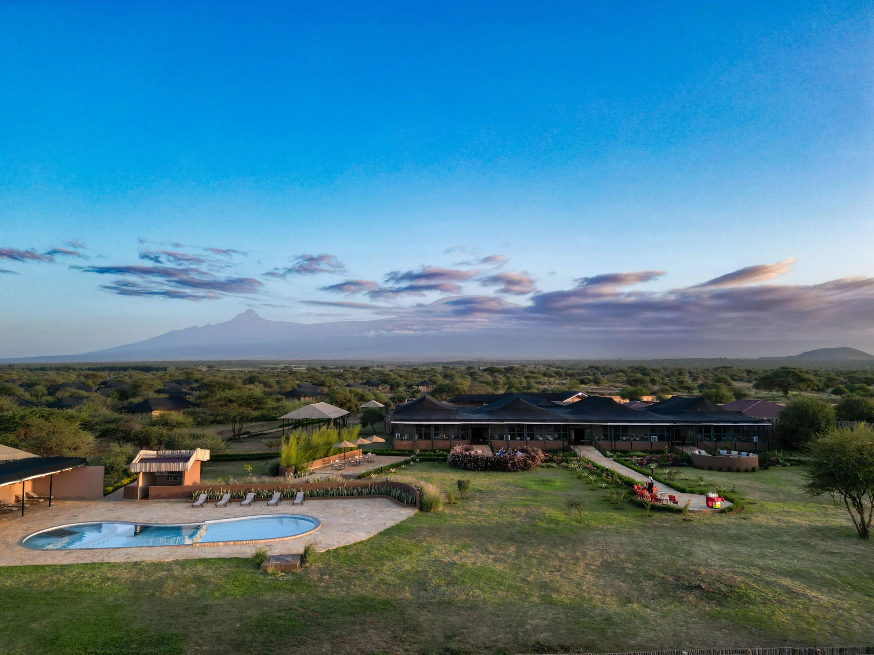 Praro Amboseli Camp — pool and lounge with Kilimanjaro beyond