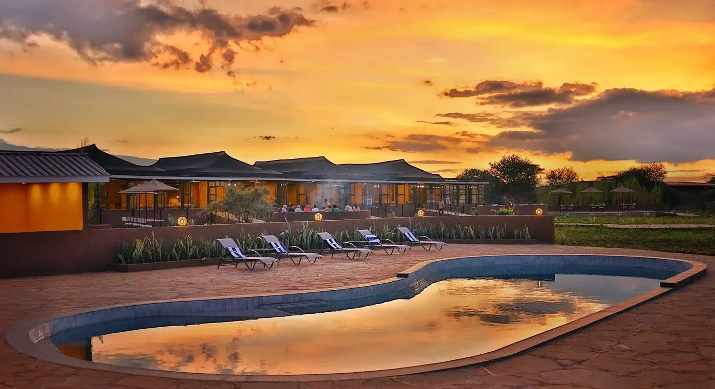 Praro Amboseli Camp — pool at golden sunset