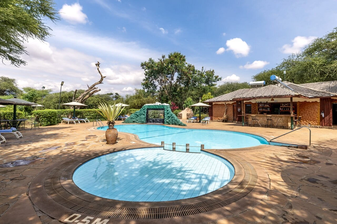 Sentrim Camp Amboseli — swimming pool with rock waterfall
