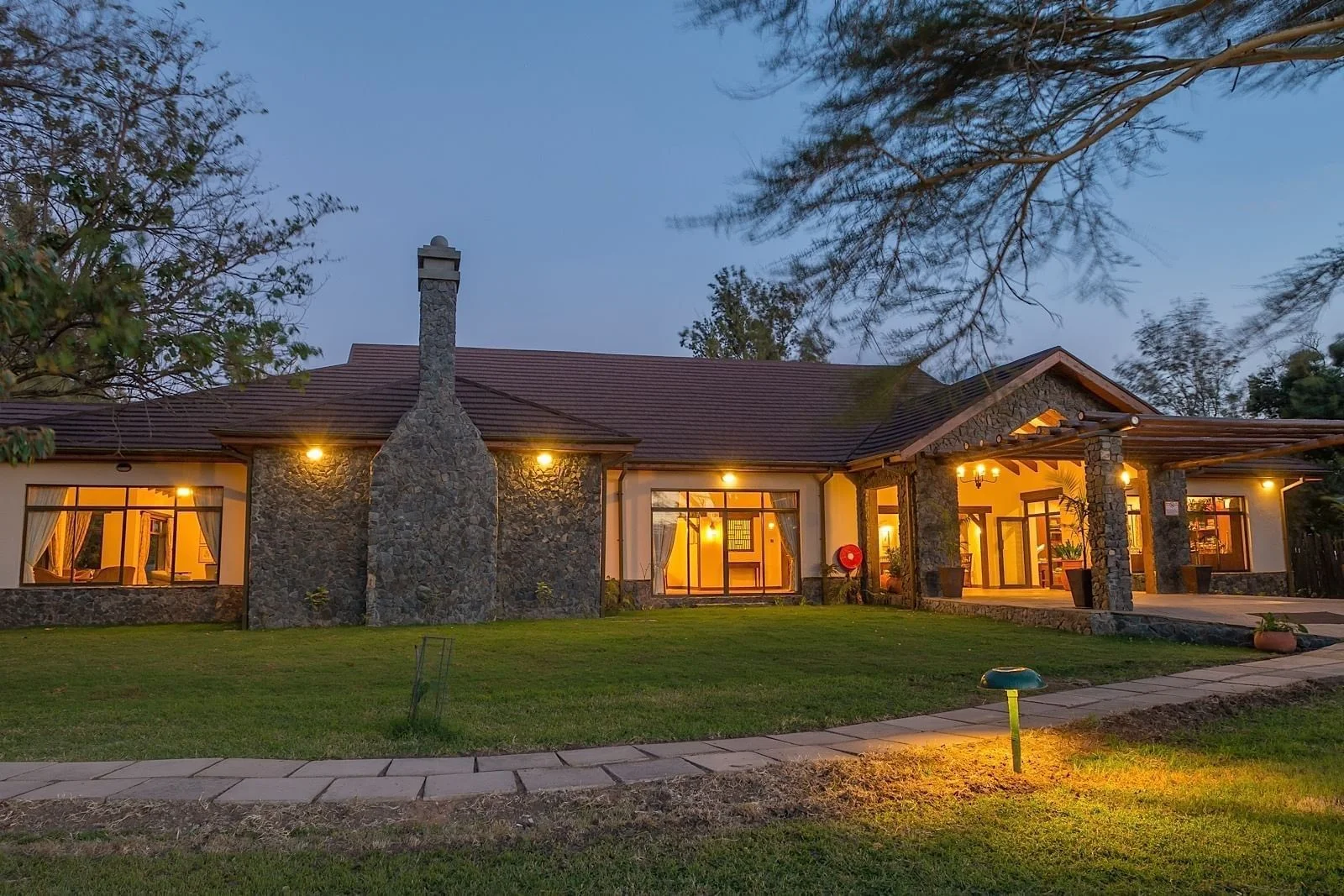 Sweetwaters Tented Camp — main lodge at dusk