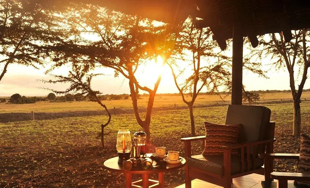 Sweetwaters Tented Camp — sundowner on the conservancy
