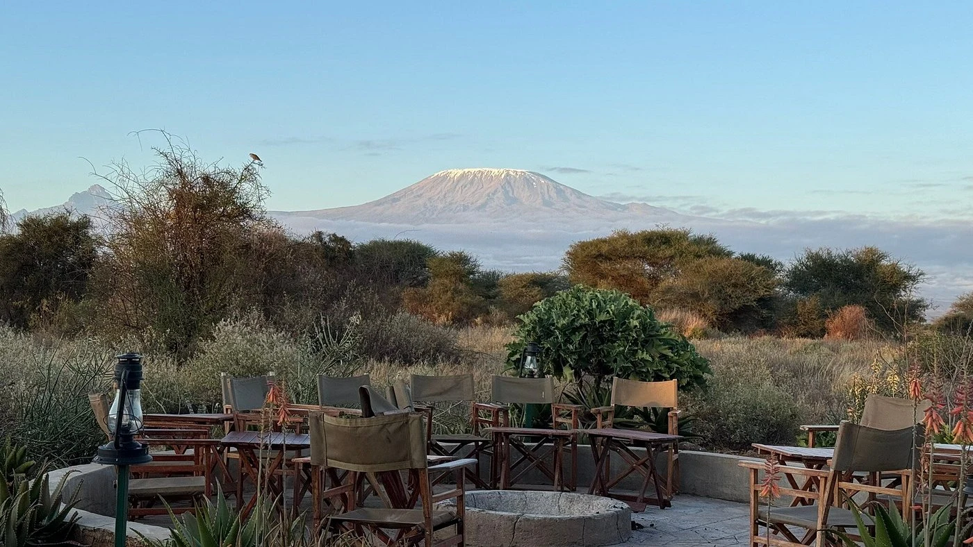 Fire pit at sunrise with Kilimanjaro in view, Tulia Camp Amboseli