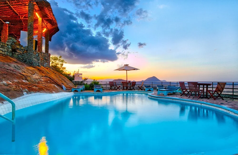 Voi Safari Lodge — pool at sunset overlooking Tsavo